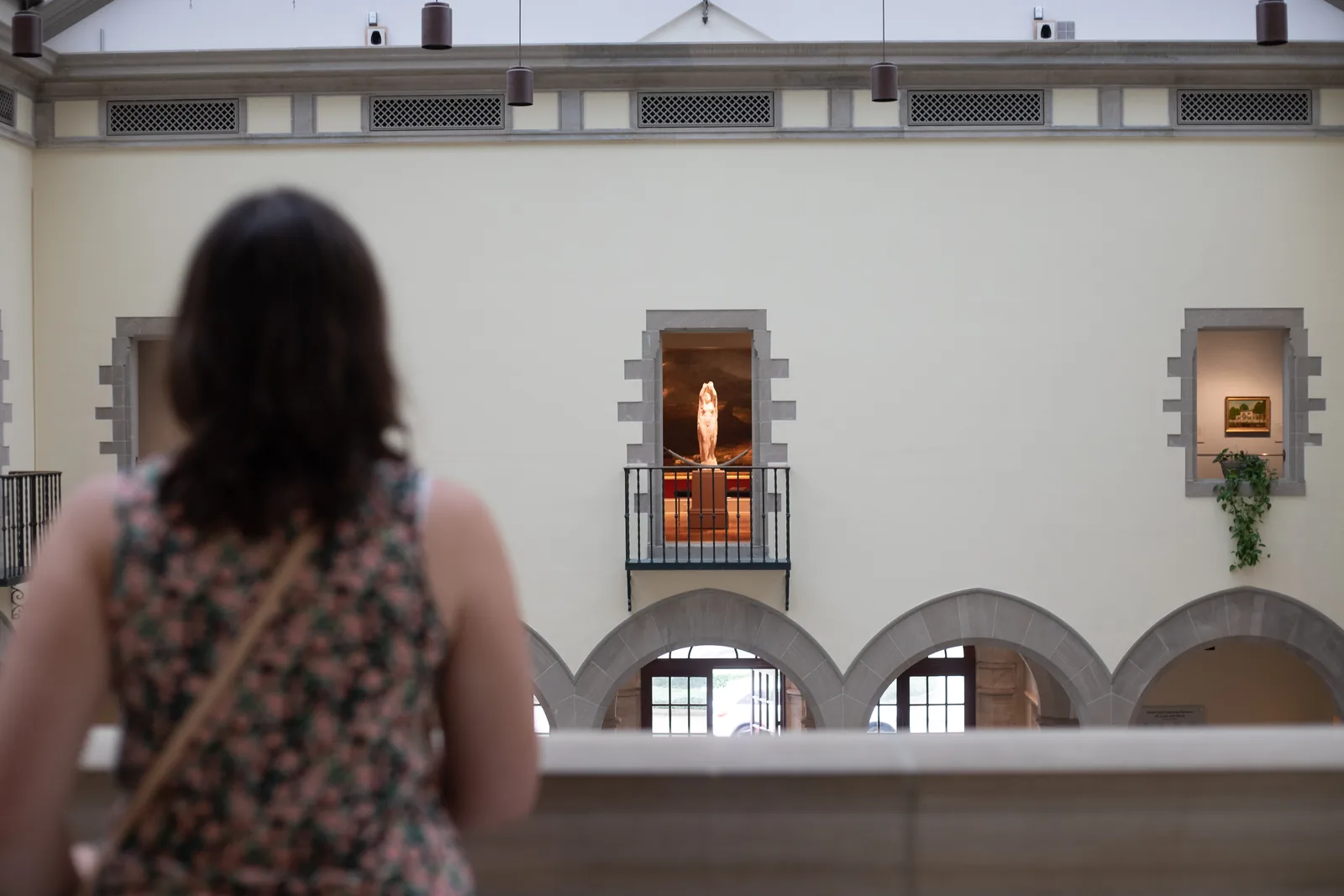 A visitor looks across the central hall of the Chrysler Museum of Art in Norfolk.