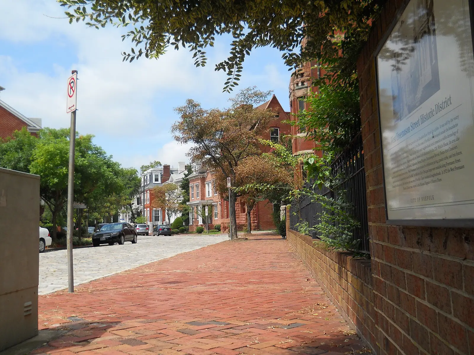 Brick sidewalk, cobbled street and the city's marker for the West Freemason Street Historic District in downtown Norfolk.