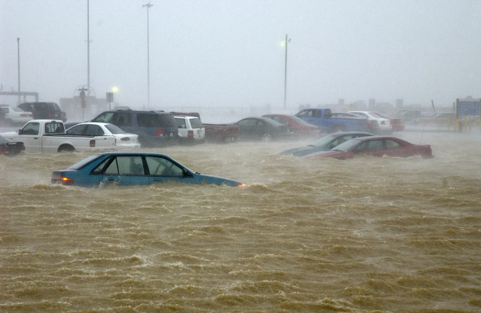 Floodwater from Hurricane Isabel swamps cars in a parking lot at Naval Station Norfolk.