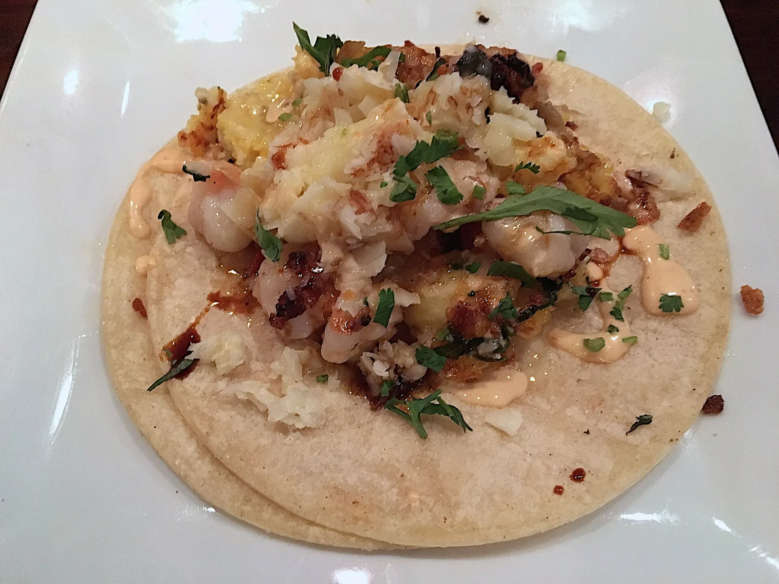 A shrimp taco on a corn tortilla. The photo was not taken at a Norfolk restaurant.
