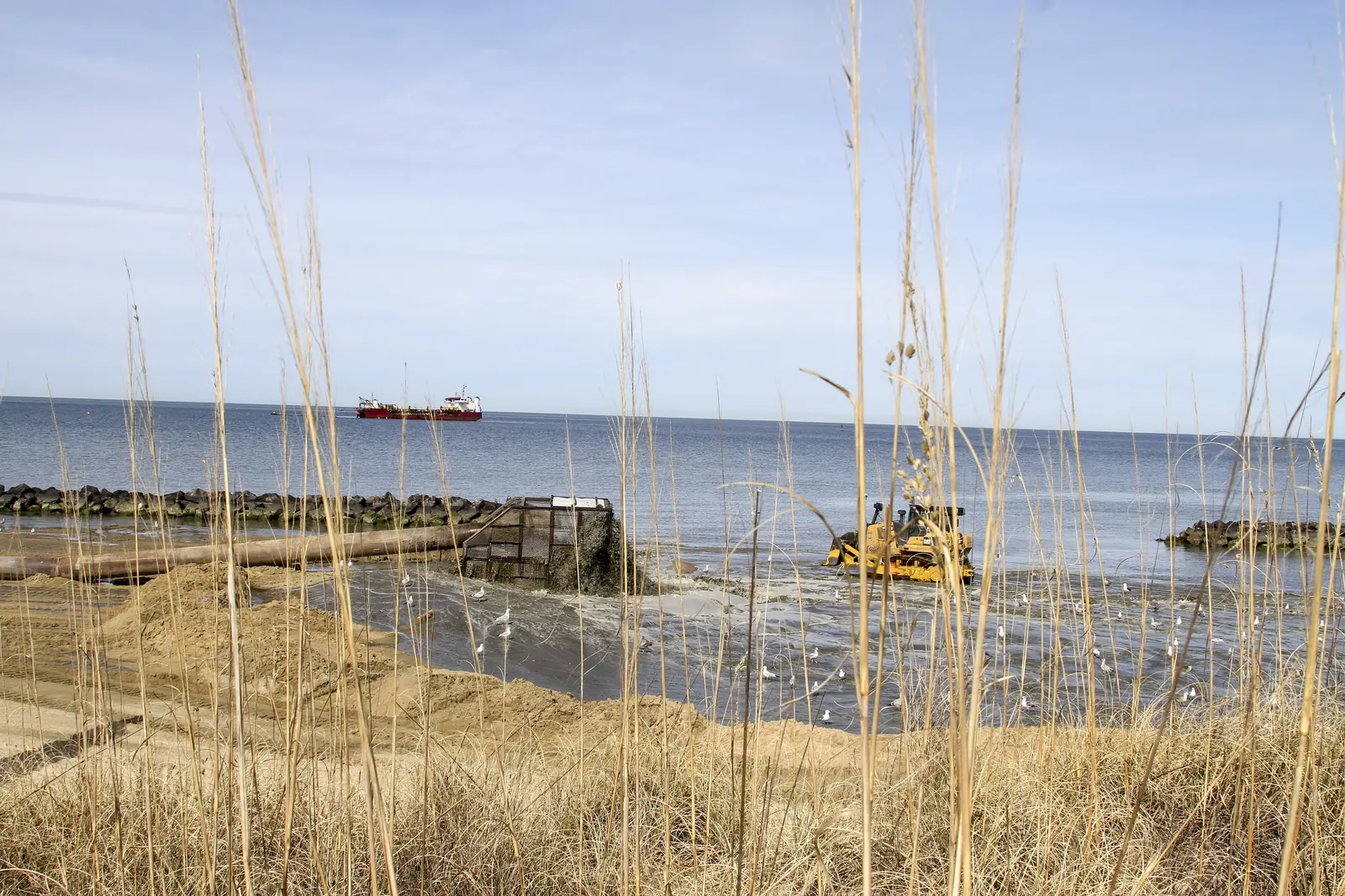 Contractors pump sand dredged from the Chesapeake Bay onto Ocean View Beach in Norfolk during an Army Corps of Engineers project in February 2017.
