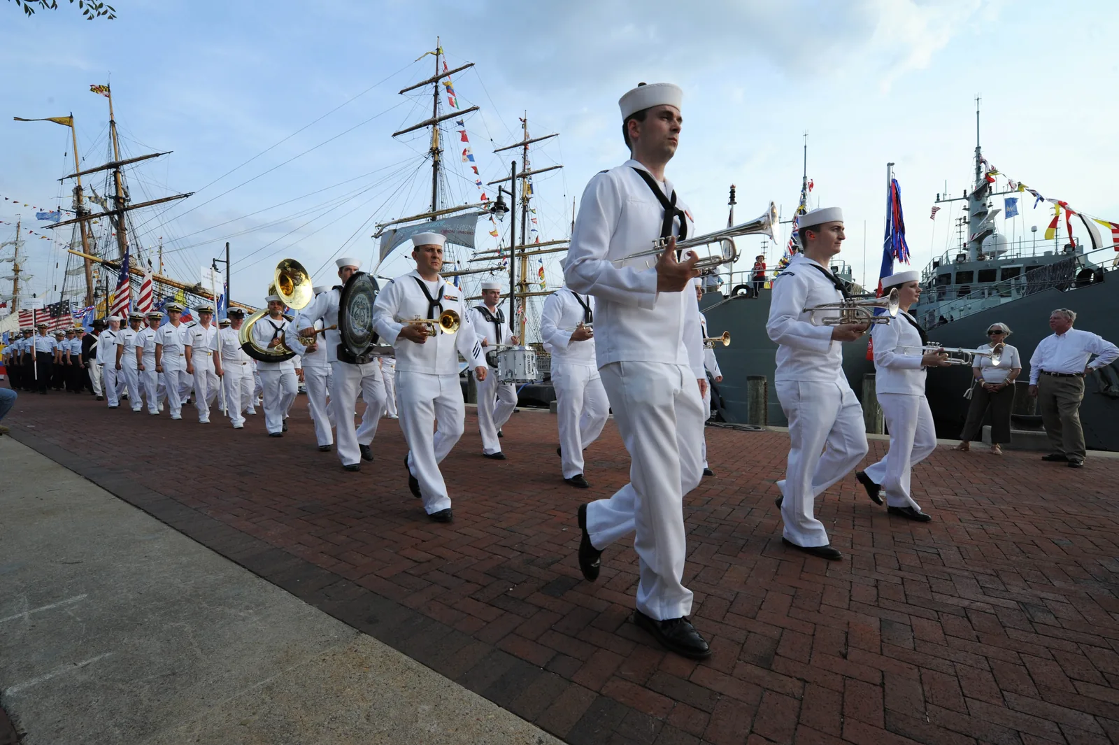 A Navy band marches along the riverfront promenade at Town Point Park in Norfolk, the jazz festival's usual home.