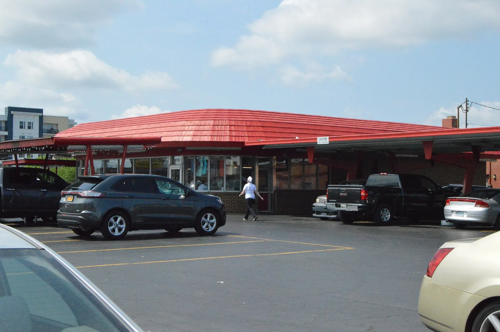 Customers park under the red canopy of the Doumar's drive-in restaurant in Norfolk.