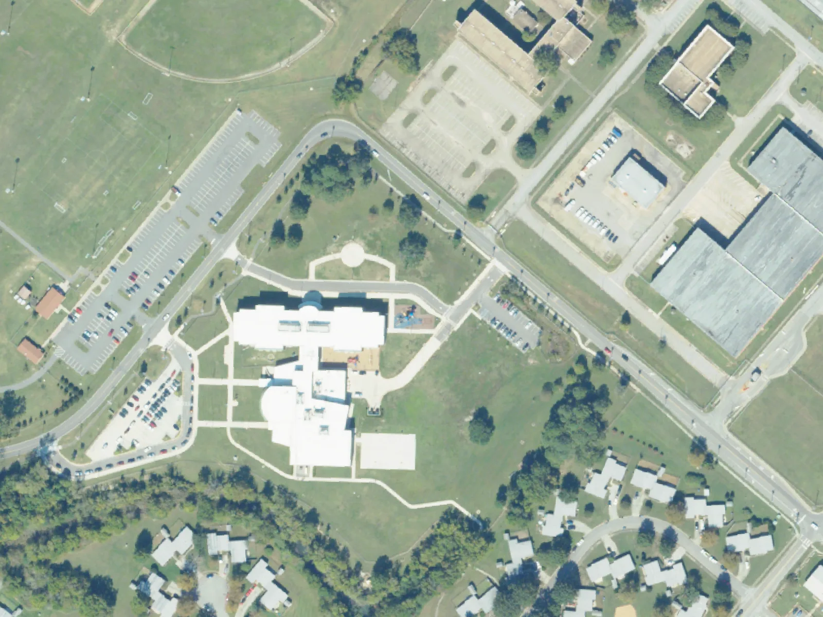 Camp Allen Elementary School and its grounds, center, from the air in October 2023.