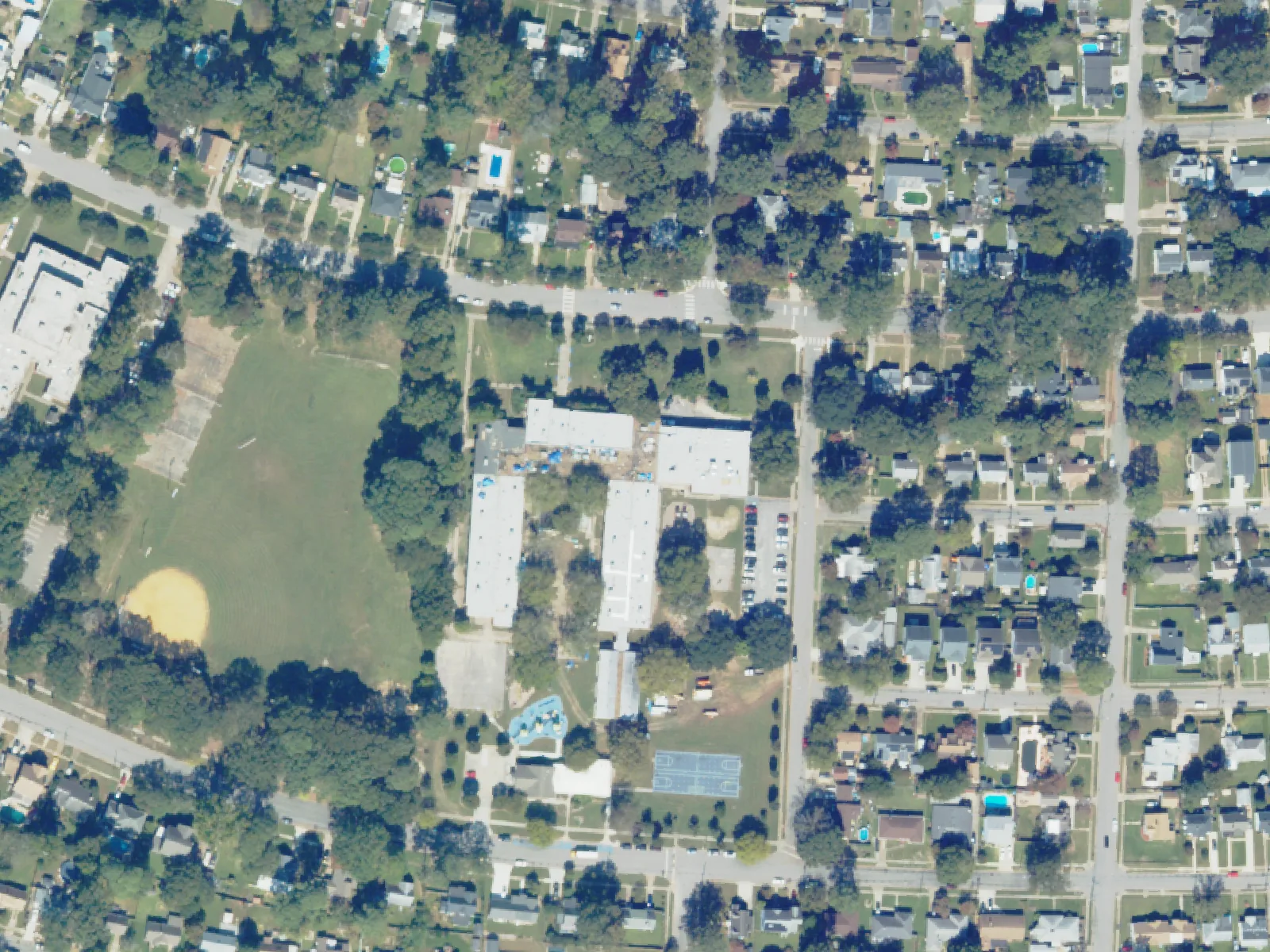 Mary Calcott Elementary School and its grounds, center, from the air in October 2023.