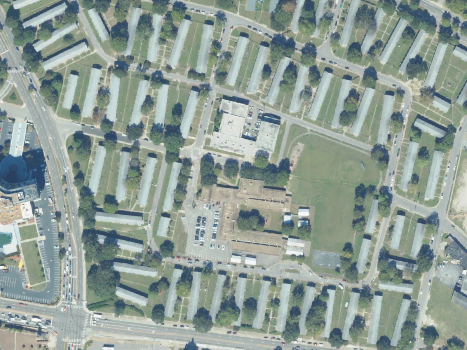 P.B. Young Sr. Elementary School, center, among the apartment buildings around East Olney Road, from the air in October 2023.