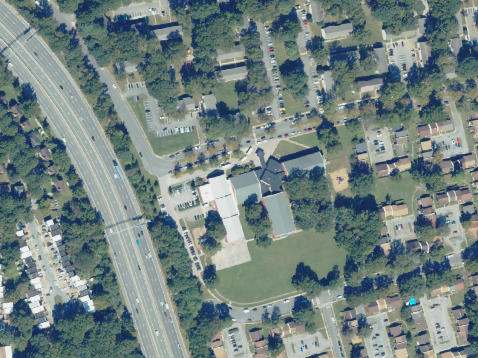 Tanners Creek Elementary School and its grounds, center, from the air in October 2023.