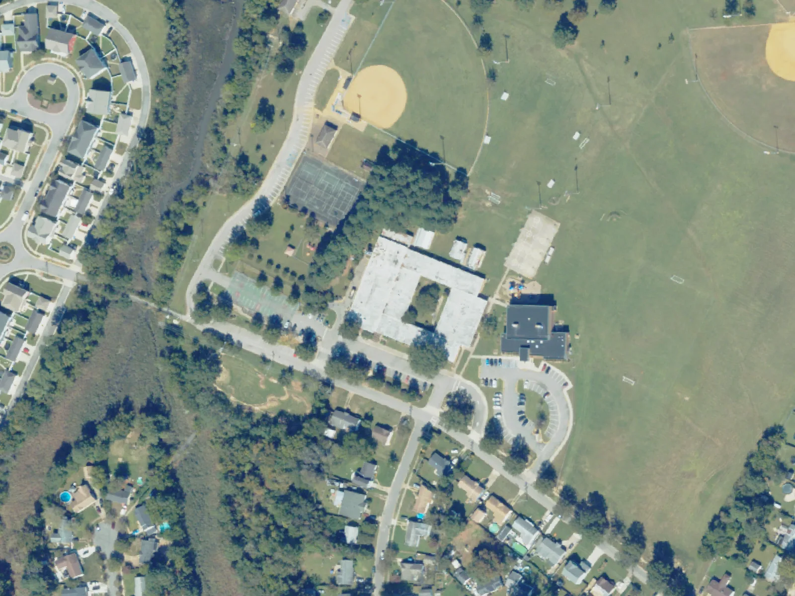 Tarrallton Elementary School and its grounds, center, from the air in October 2023.