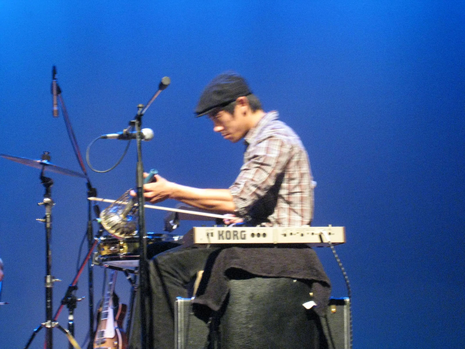 A musician performs on the stage of the Attucks Theatre on Church Street, where Choir! Choir! Choir! plays Sunday night.
