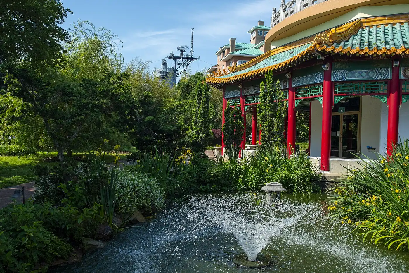 The Pagoda and its garden pond on the downtown Norfolk waterfront, a stop on the Elizabeth River Trail, with the Battleship Wisconsin's mast behind.