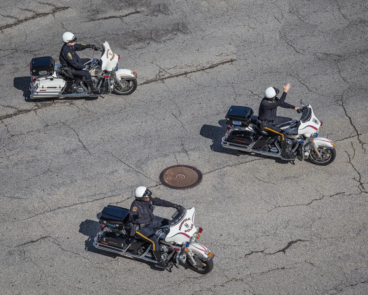 Norfolk Police and Norfolk Sheriff's Office motorcycle officers ride in the Norfolk NATO Festival parade downtown.